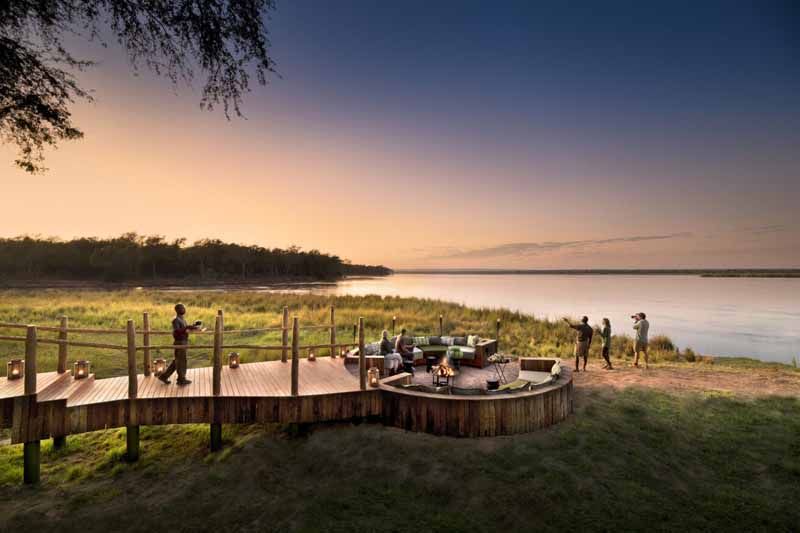 Sundowners on a riverside deck in Zambia