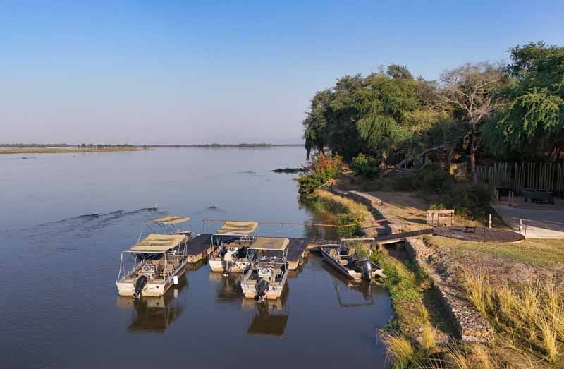 Aerial view of the Zambezi River curling past Lolebezi Safari Lodge