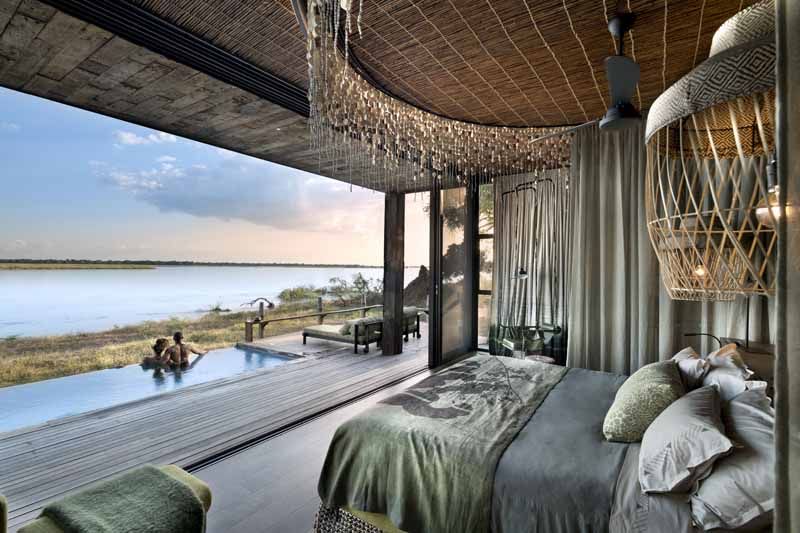 Suite bedroom at Lolebezi with uninterrupted views of the Zambezi