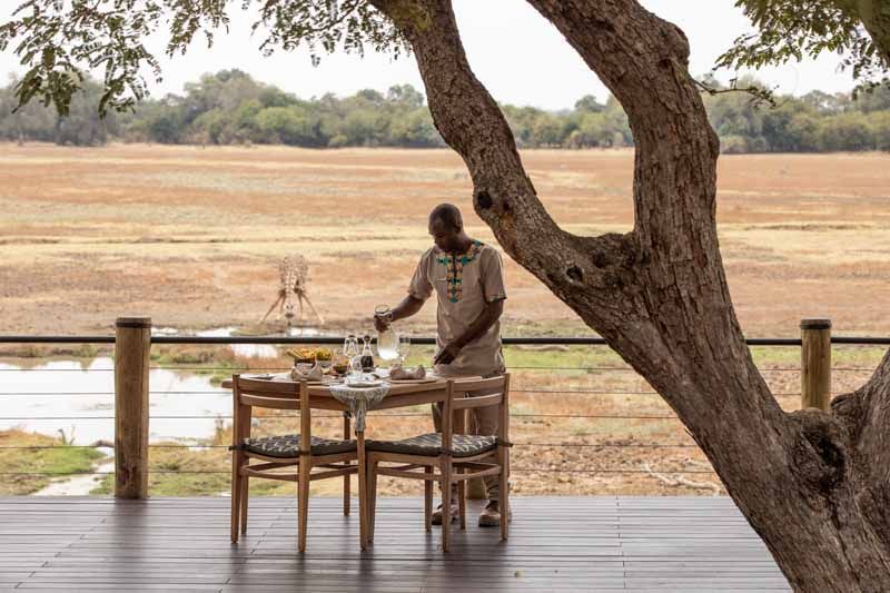 Dining beneath the trees at Puku Ridge